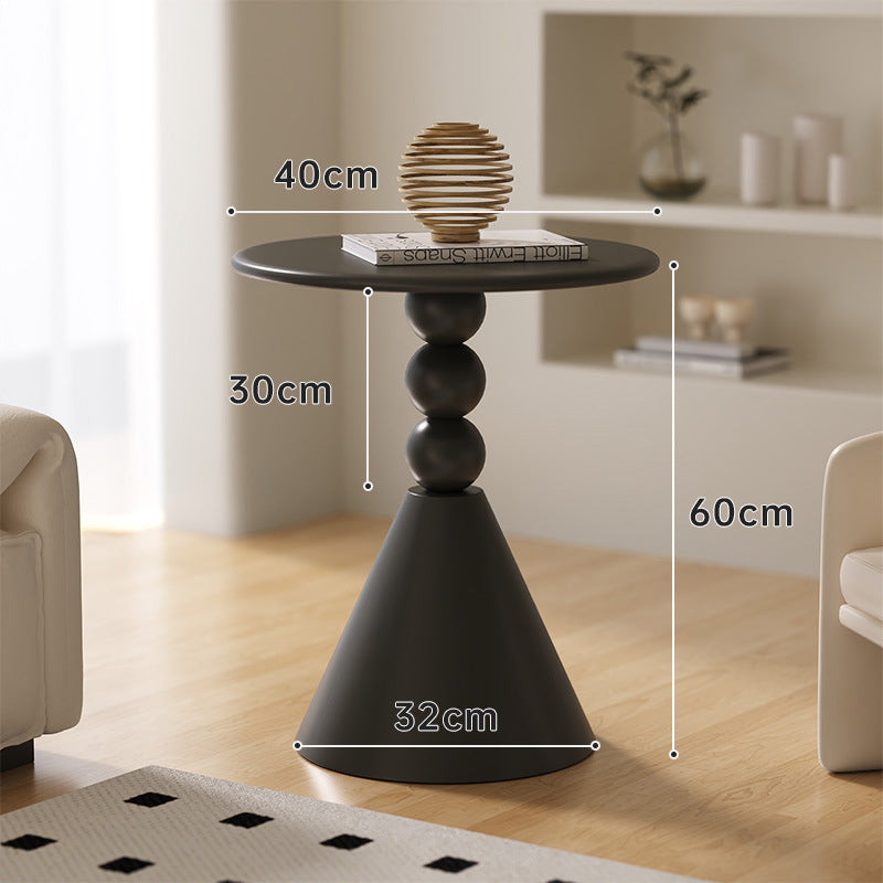A small iron round table on the balcony