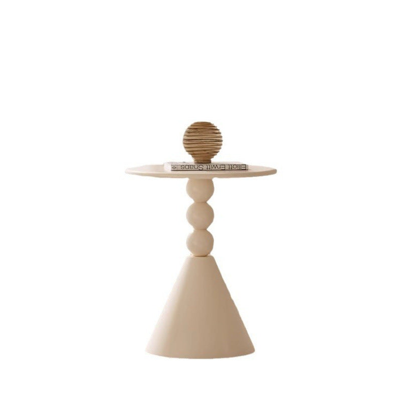 A small iron round table on the balcony